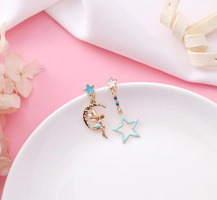 Asymmetric Earrings with Star and Moon Design in Pink