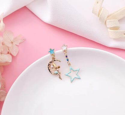Asymmetric Earrings with Star and Moon Design in Pink