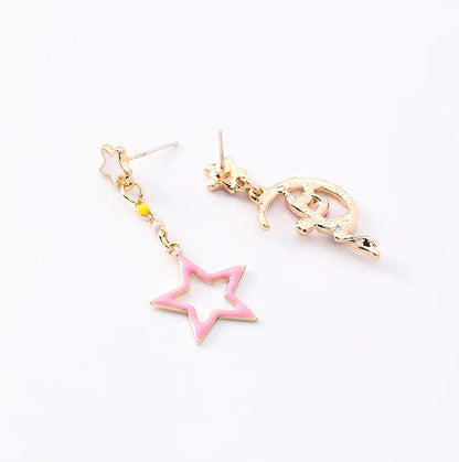 Asymmetric Earrings with Star and Moon Design in Pink